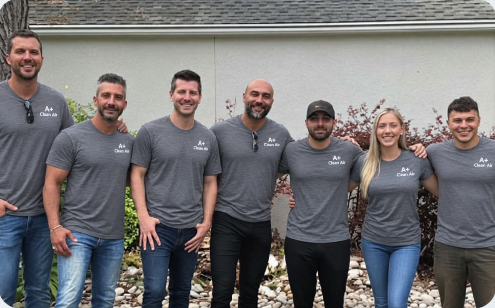 The Clean Air Duct Inc service team in branded gray shirts